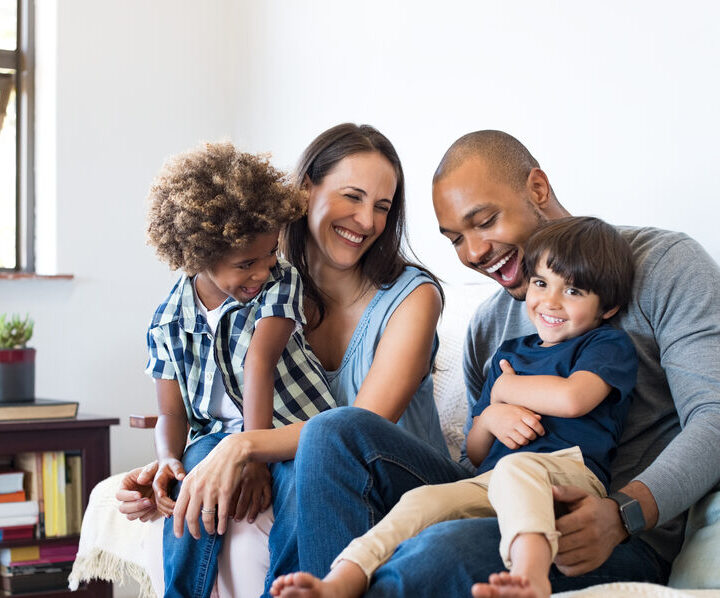 Family laughing together at home