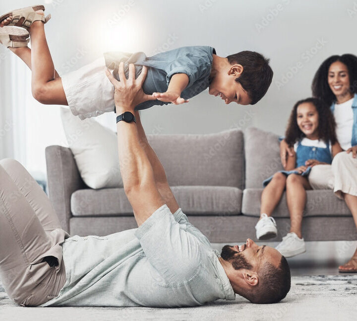 Father playing with his toddler at home